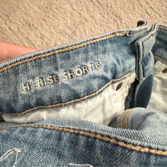 AE Light Wash Distressed High Rise Shortie Eyelet Pockets Denim Shorts - Picture 7 of 9